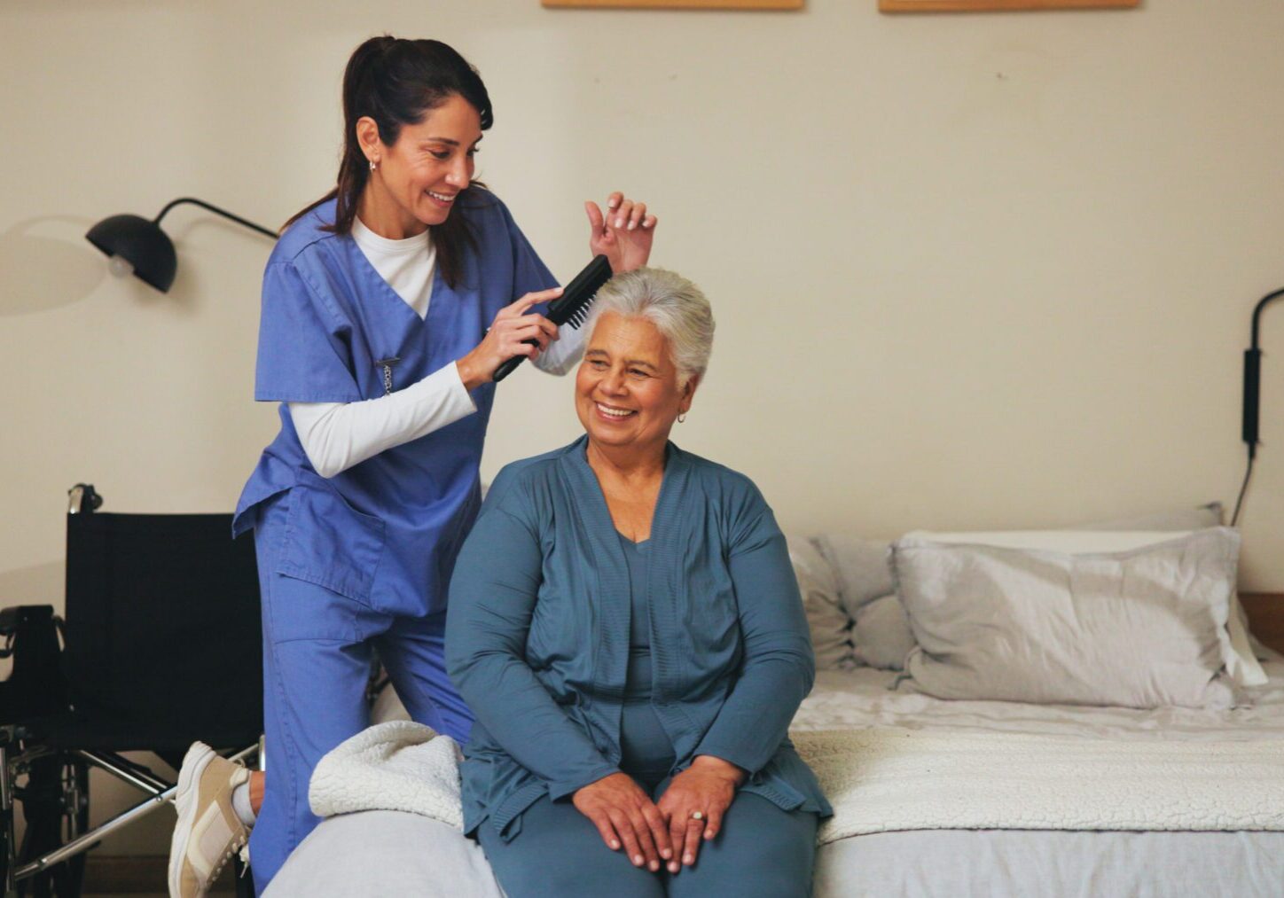 Nurse, brush and senior patient with hairstyle for self care, grooming or morning routine at assisted living. Healthcare, retirement home and caregiver help elderly woman with beauty treatment.